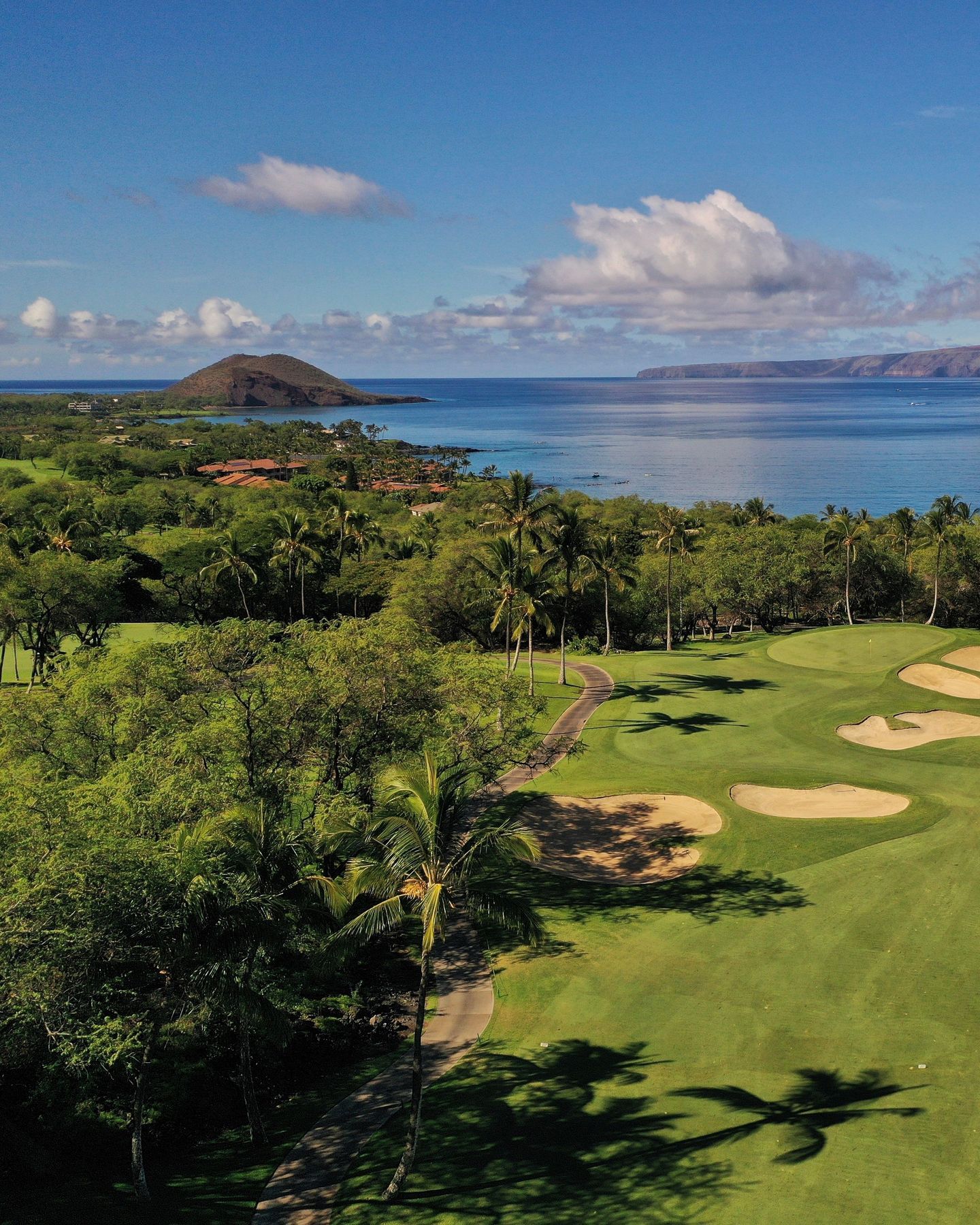 View of Wailea Golf course with volcano and beach in distance